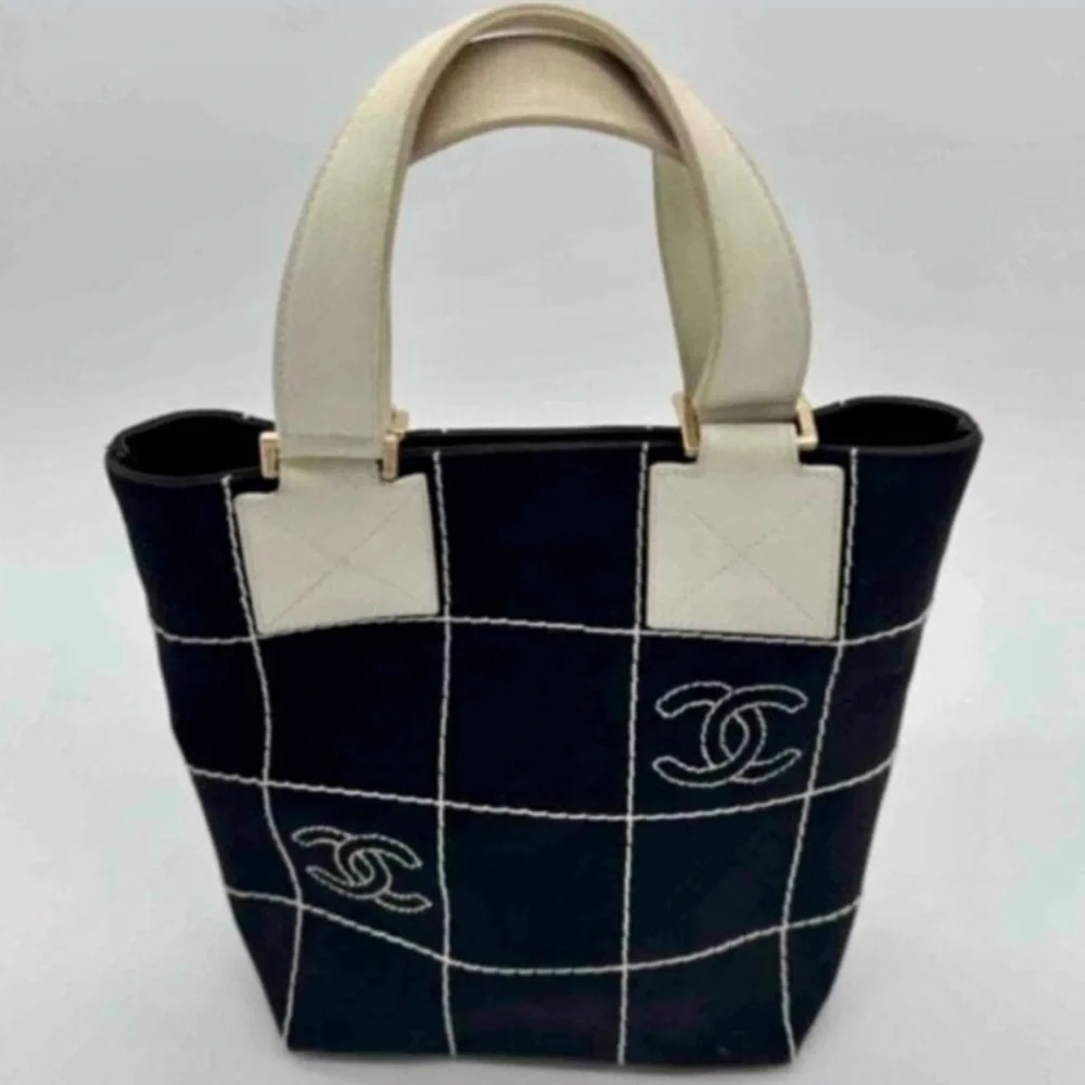 CHANEL Black Tote with Cream Handles and Grid Stitching